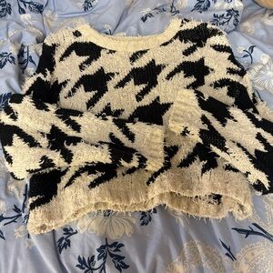 Fuzzy white sweater with black design